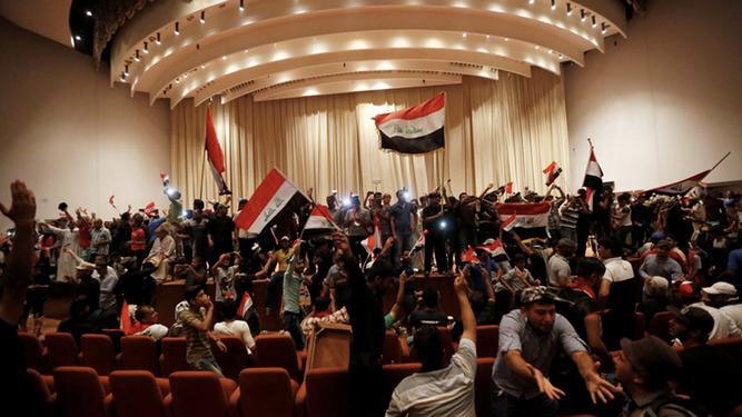 Iraqis protestors dance & sing in parliament